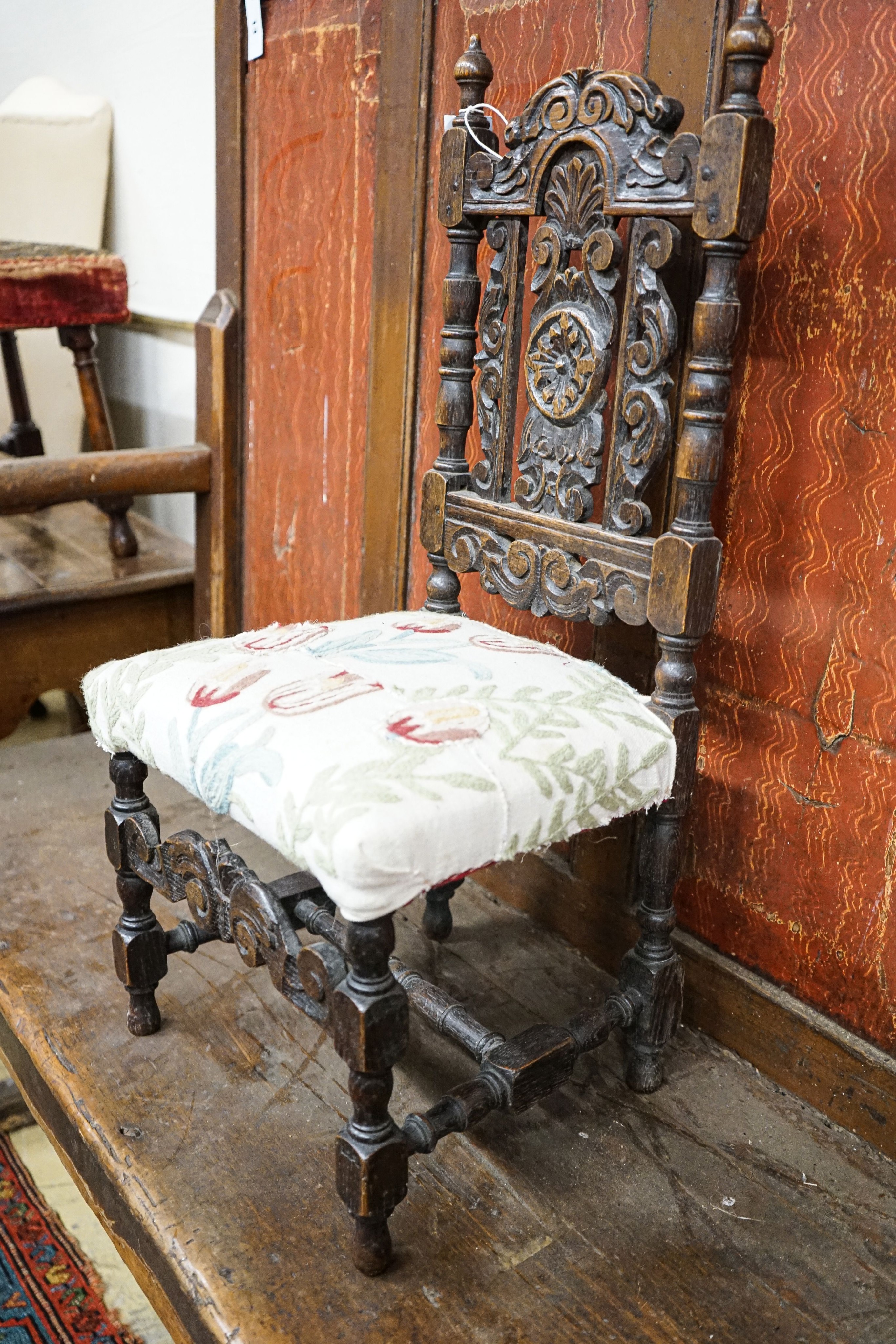 A Carolean style carved oak child's chair, height 70cm